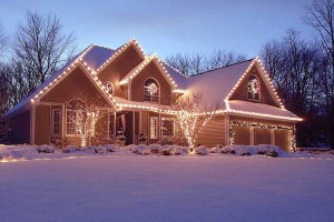Residential home decorated for Christmas with cheerful lights near Rogers, MN.