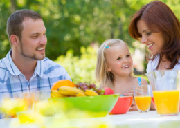 A family enjoying a backyard picnic.
