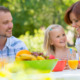 A family enjoying a backyard picnic.
